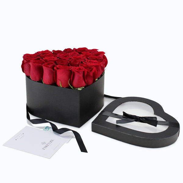 Elegante caja negra en forma de corazón de 24 Rosas rojo + Chocolates